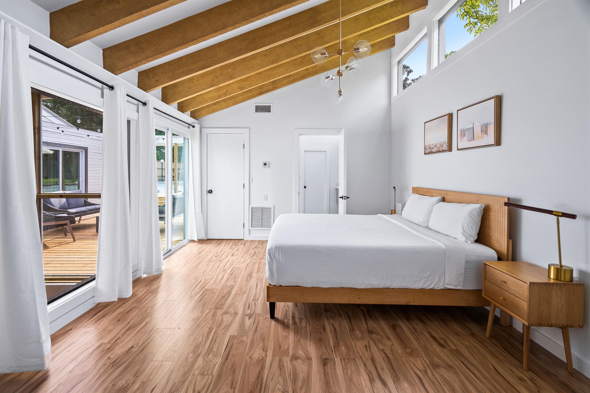 King bed primary bedroom with en suite soaking tub and shower. Bedroom 1