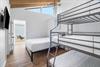 Queen bed with triple bunk, queen on the bottom,a full in the middle and twin on top with en suite bathroomshower. Bedroom 4