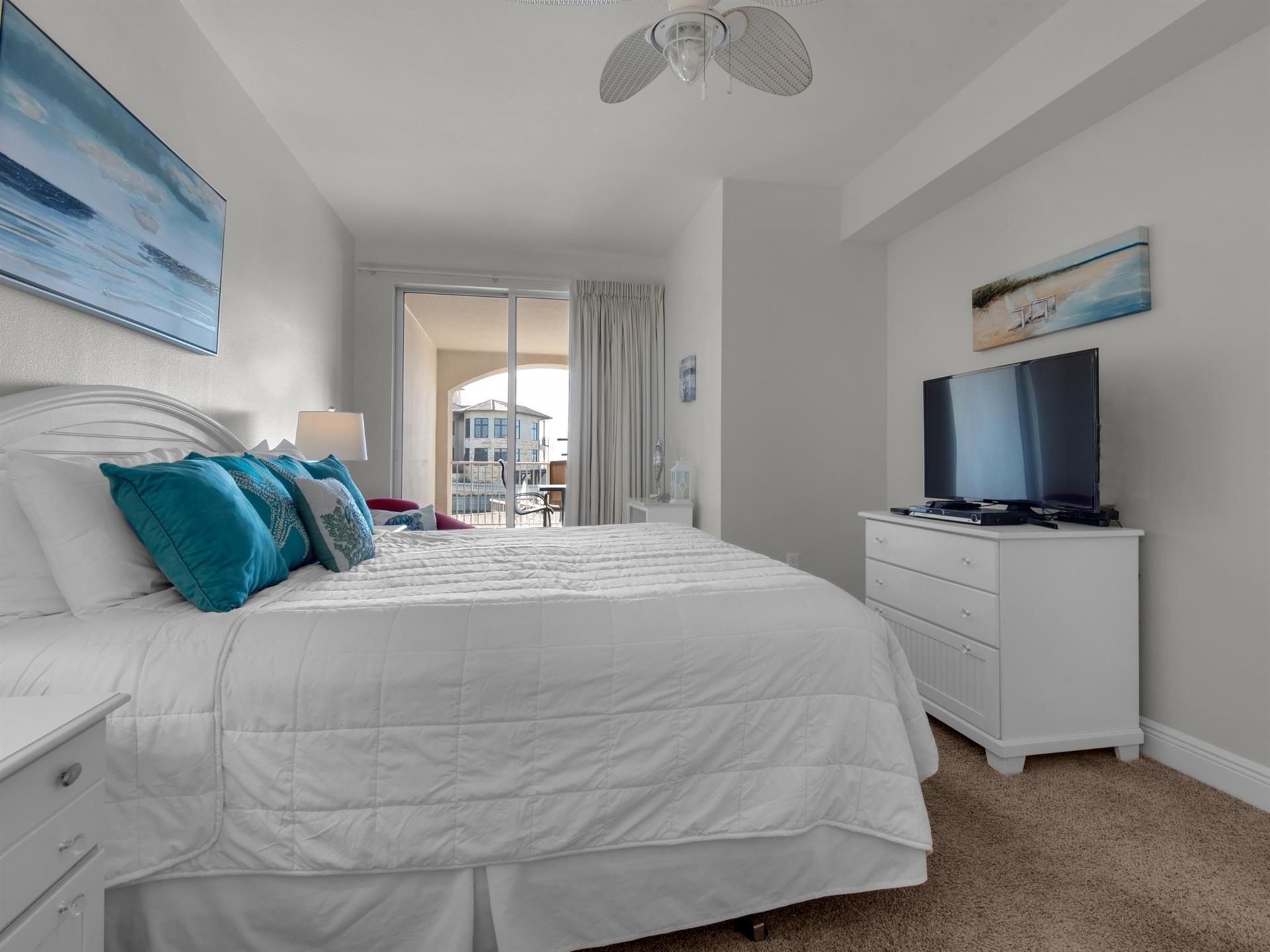 Primary bedroom with balcony access