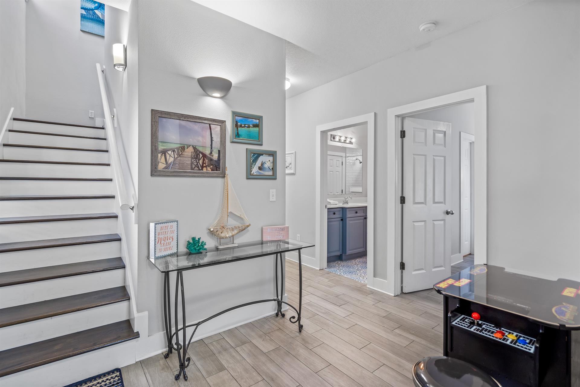 Attractive first floor foyer with a nook for the game arcade the kids will love.  3 additional bedrooms occupy this first floor.