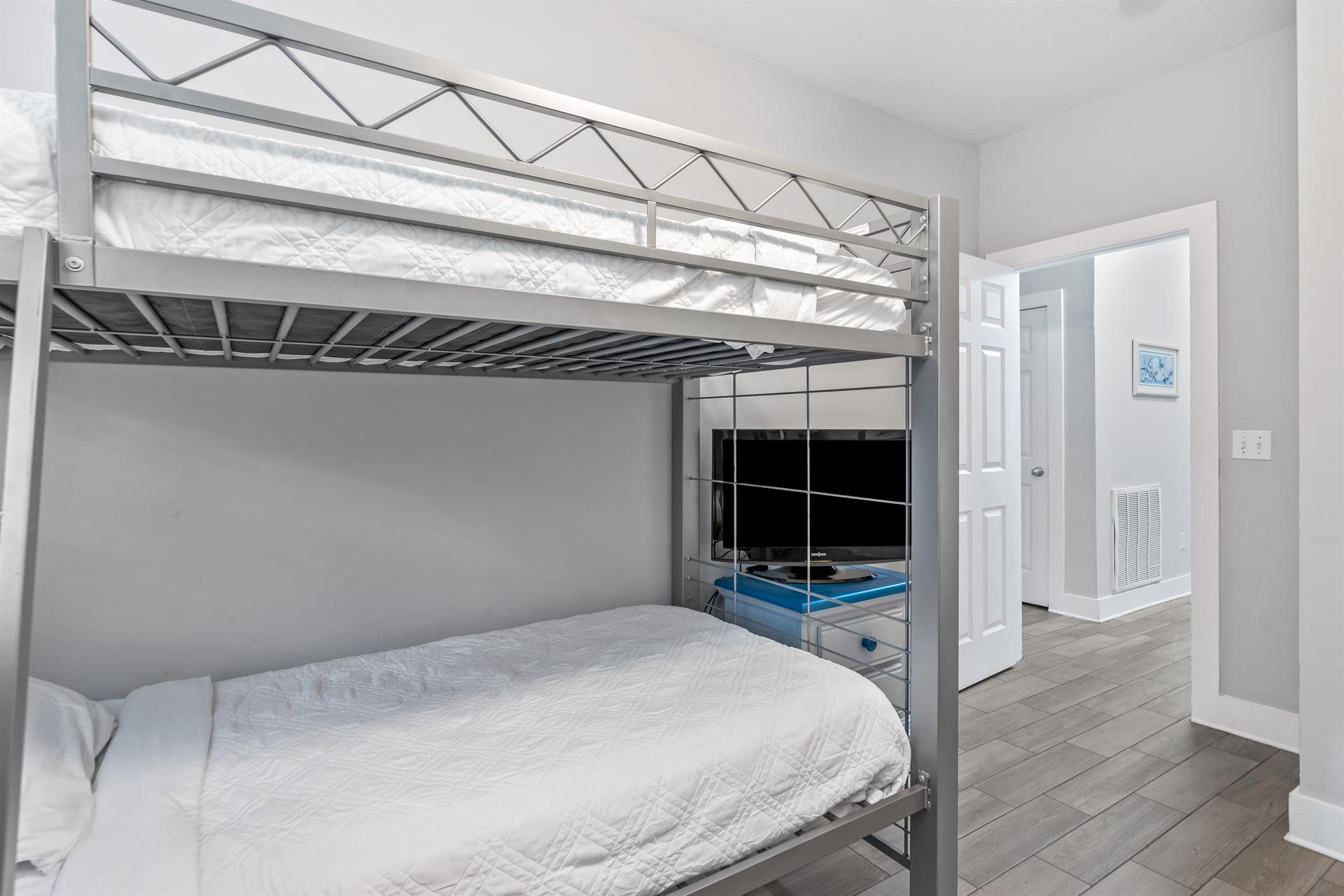 First floor bunk bedroom with 2 sets of twin over twin beds  a 31 tv with cable.