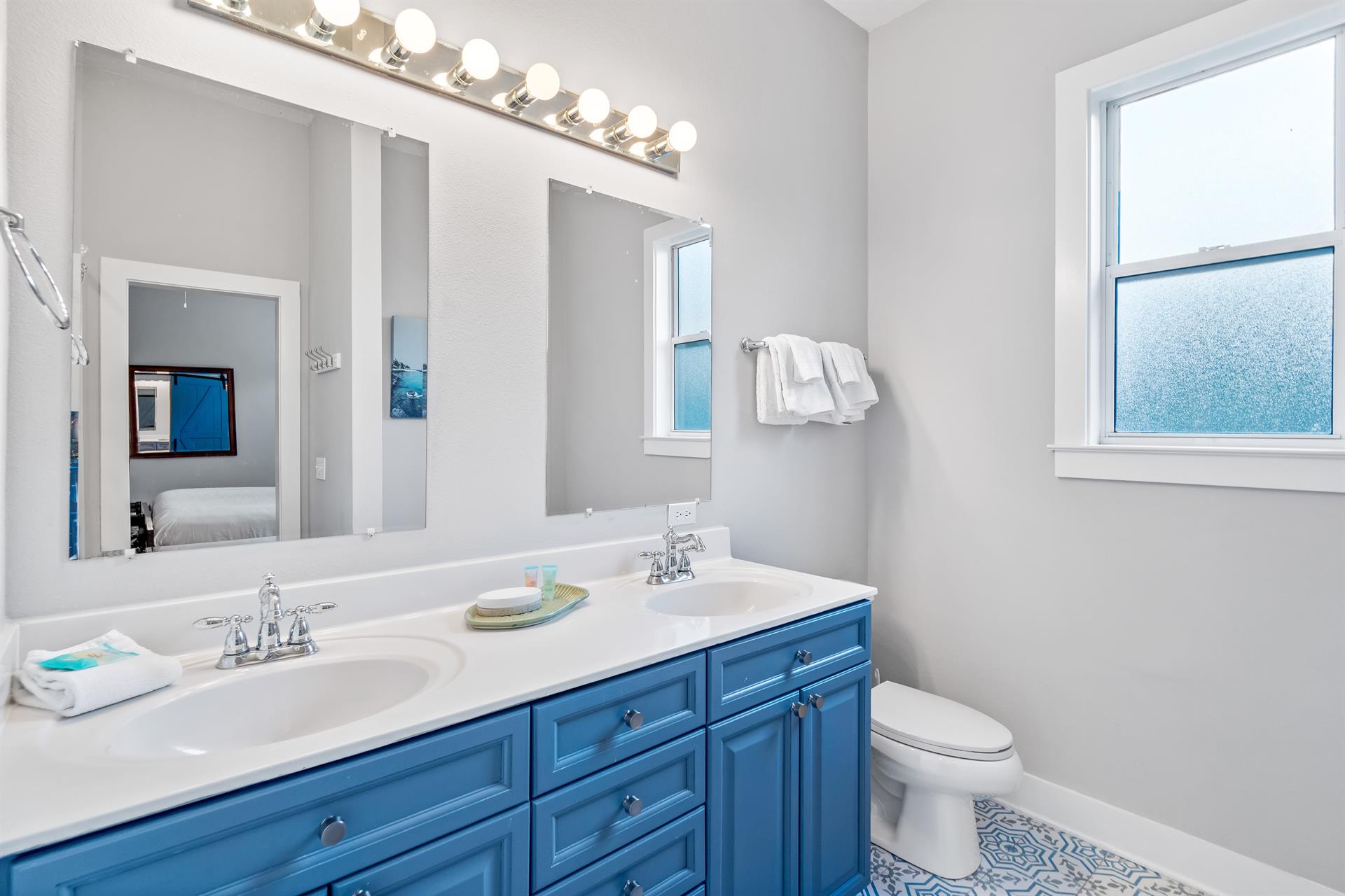 2nd floor ensuite bathroom for the primary king bedroom with double vanities, separate walkin shower  soaking bathtub.