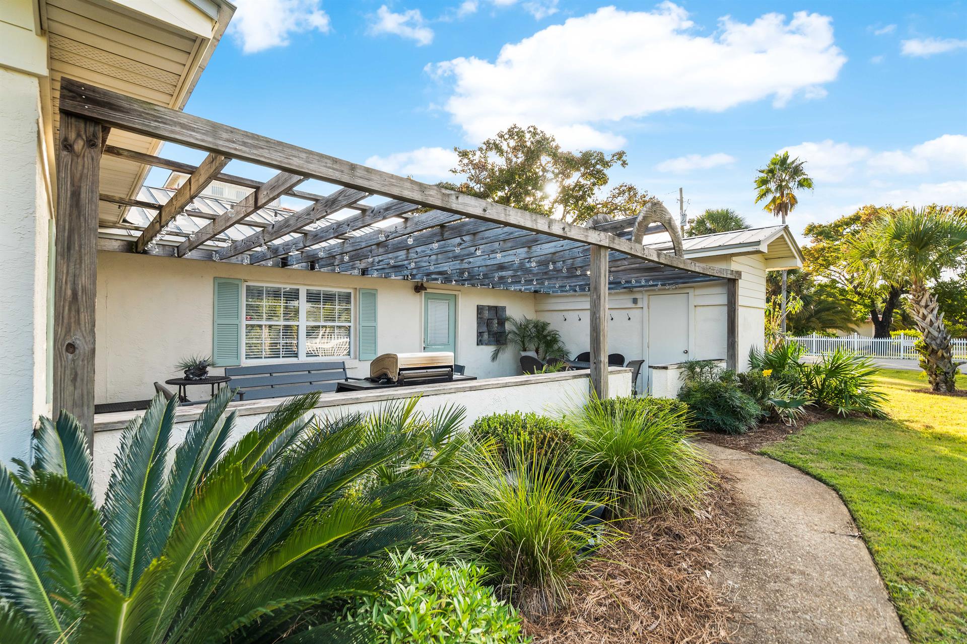 Front Porch with Plenty of Comfortable Seating, Gas Grill and Outdoor Dining Under the Cafe Lights