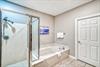Master Bathroom with Soaking Tub and Walk In Shower