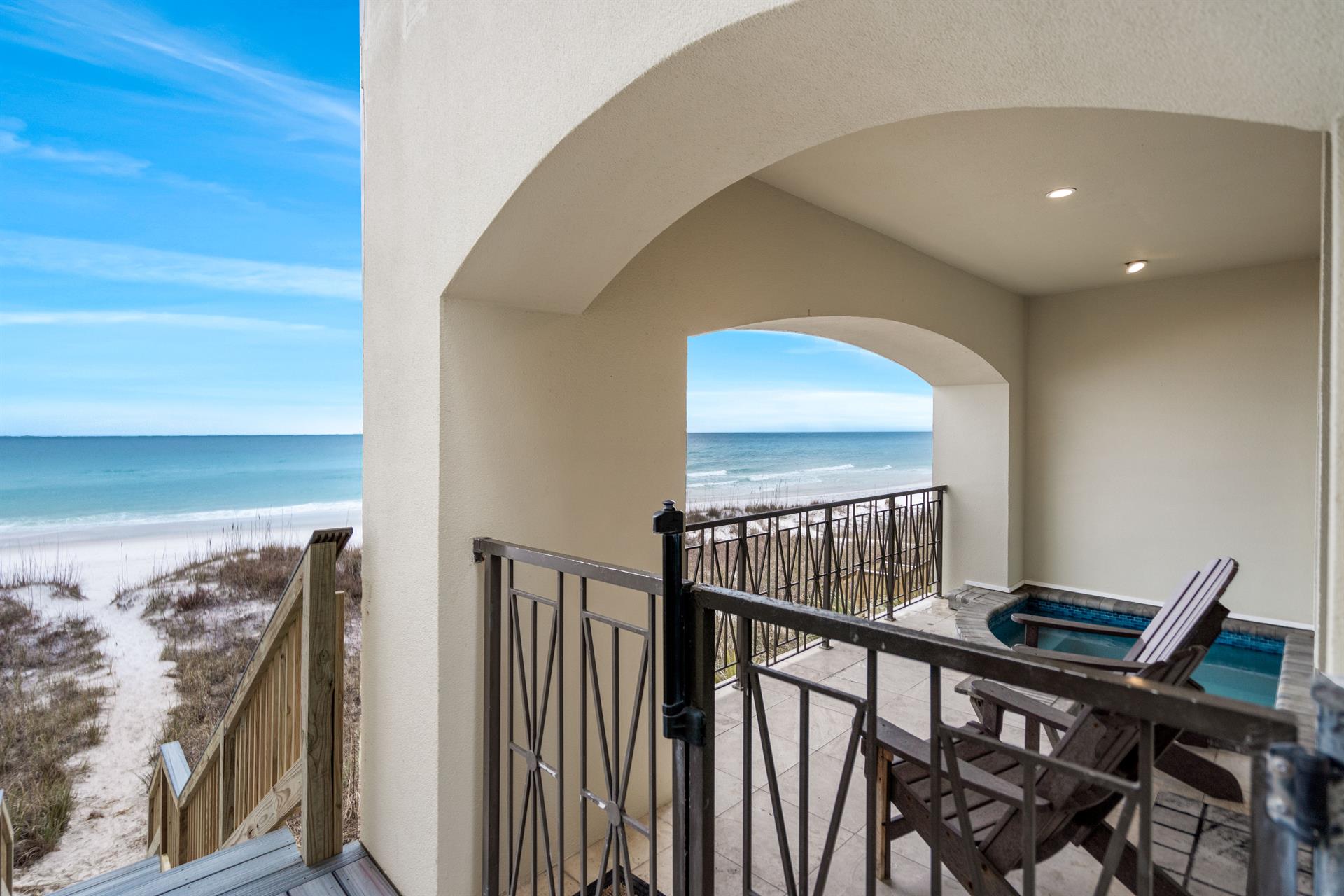 Steps down to the beach from the pool area