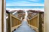 Steps down to the beach from the pool area