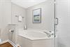 Primary Bathroom with Oversized Tub and WalkIn Shower