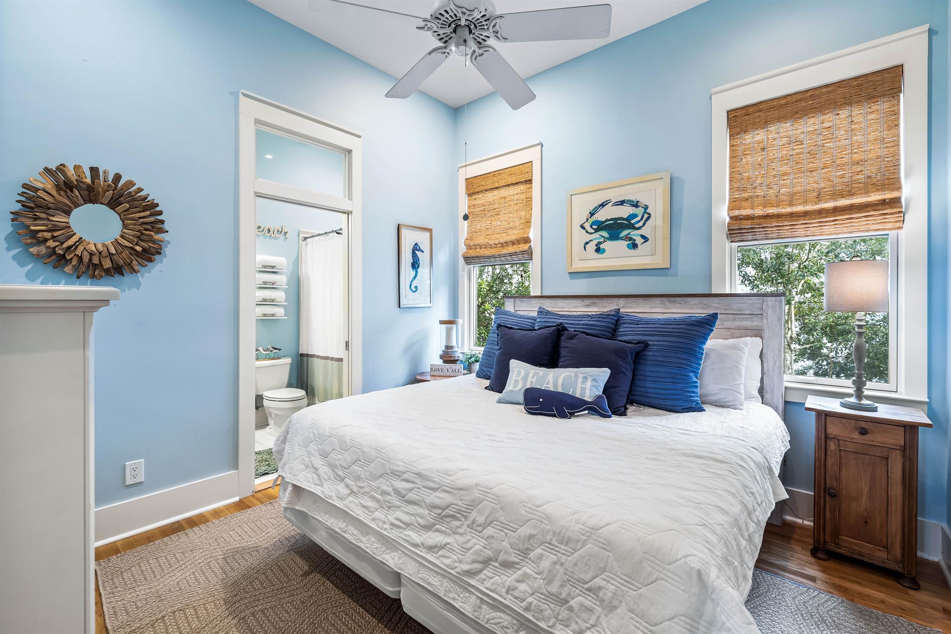 Stylish woven window shades in this serene king bedroom with your en suite bathroom