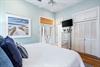 Primary king bedroom with French doors out to your private deck.  40 Smart TV