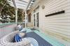 Back deck seating area with plenty of hooks for beach  towels
