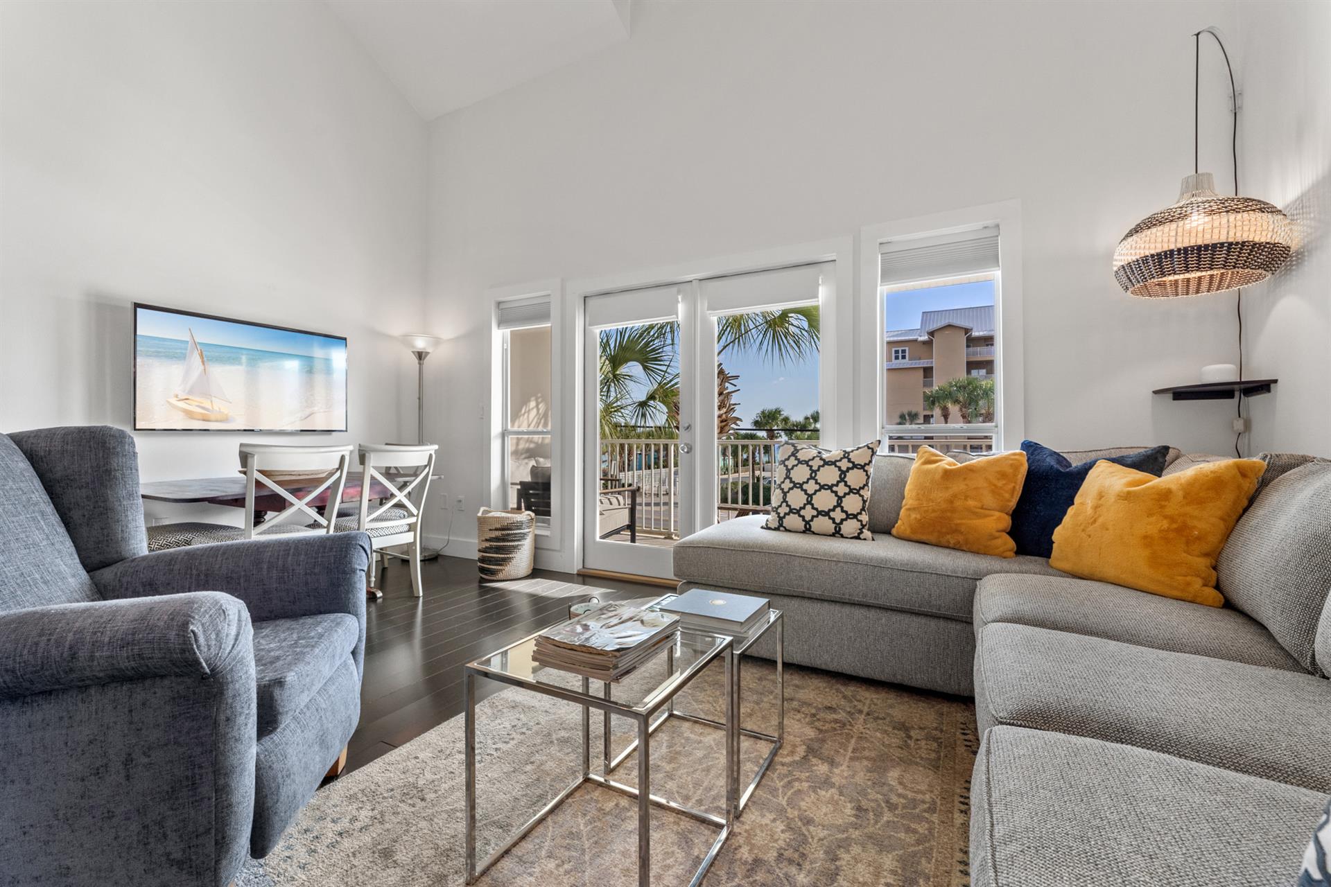 Living Room with Balcony Access and Flat Screen TV