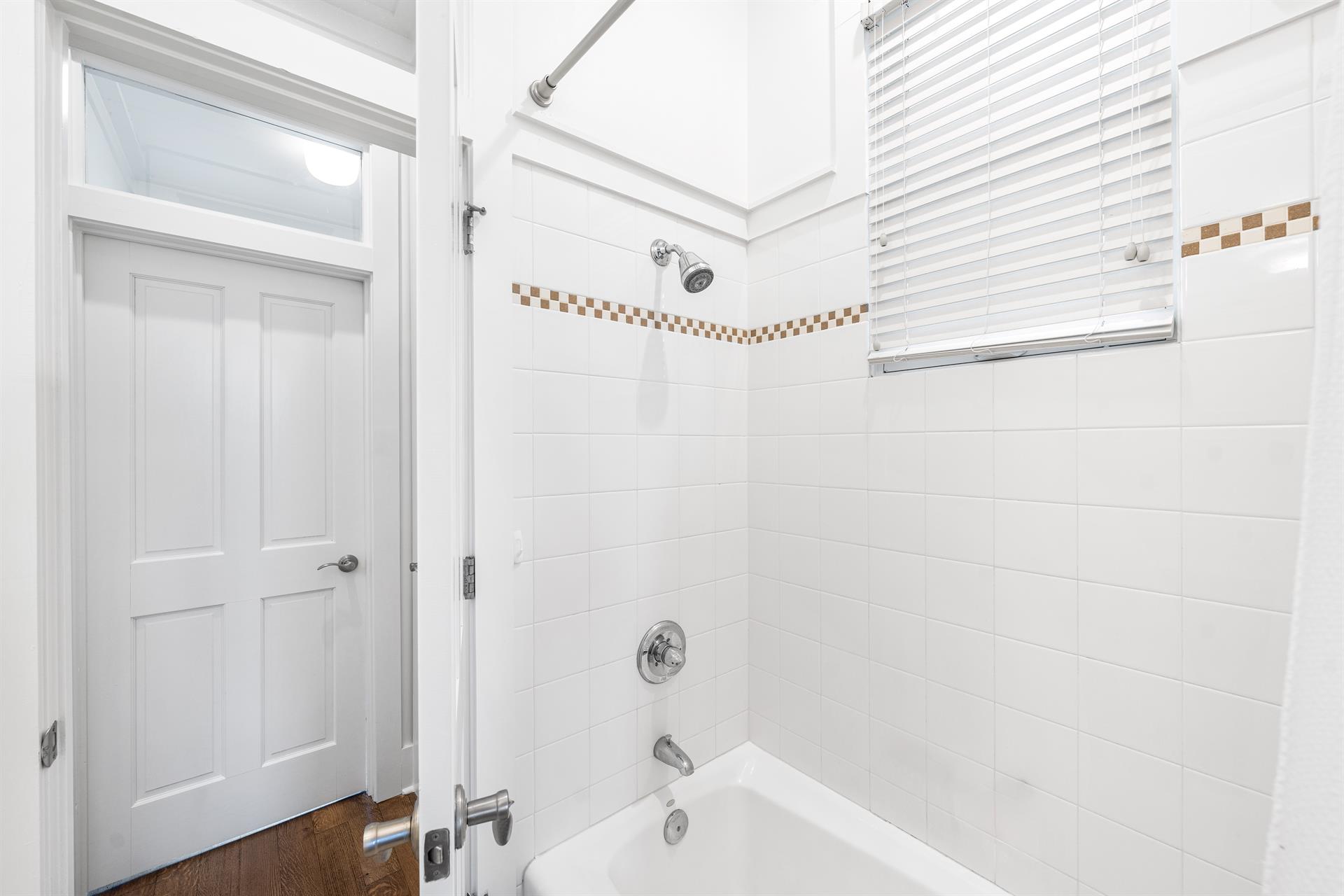 Full Bathroom with BathtubShower Combination in the 1st Floor Bedroom with Queen Bed, with 32 YouTube TV.  This bathroom can also be accessed from the hallway.