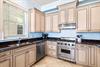Amazing Kitchen with a Viking Gas Range, Stainless Steel Appliances, Granite Countertops and Custom Cabinetry.  Separate Ice Maker for Filling Up your Cooler