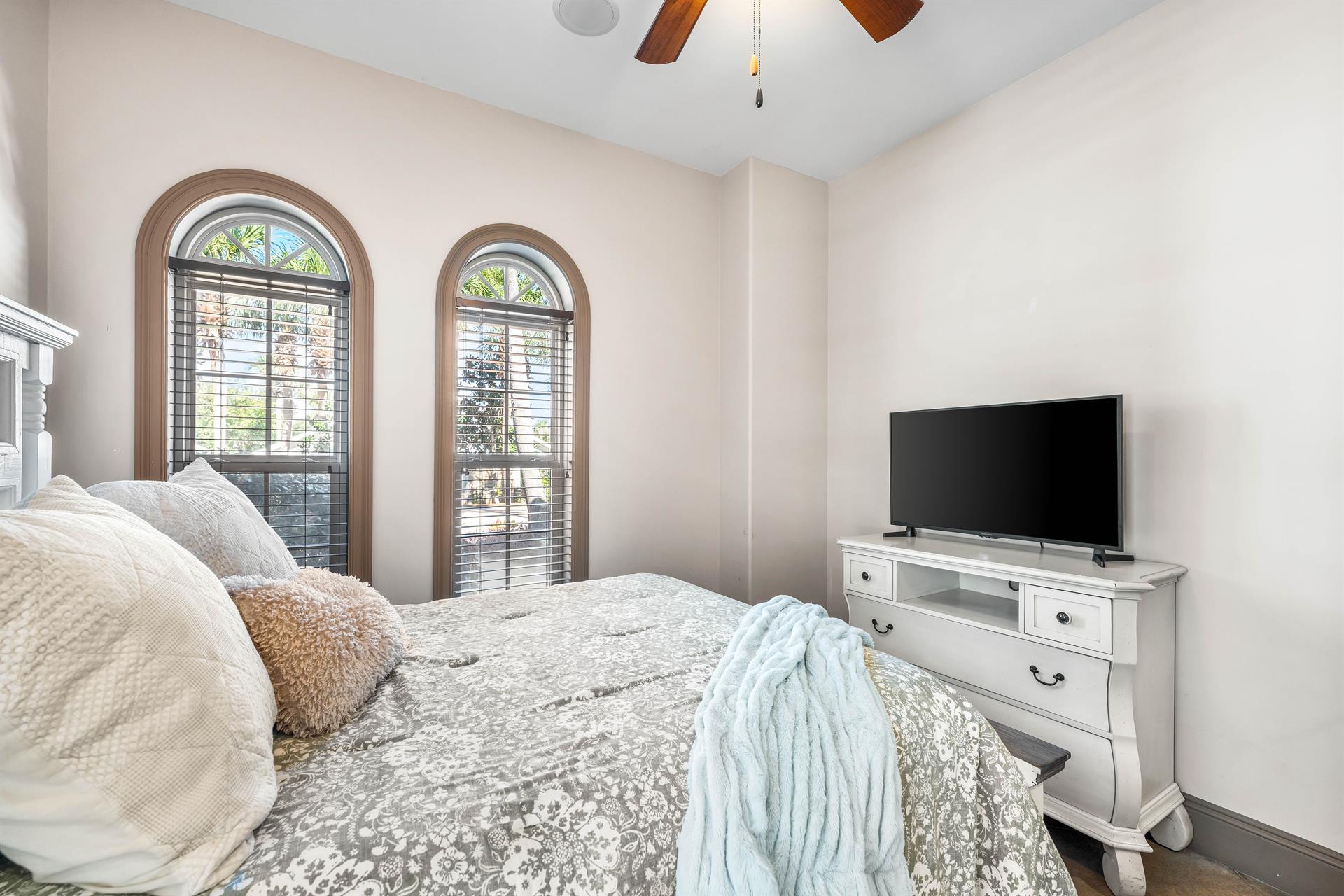 This queen bedroom has a 42 smart tv.