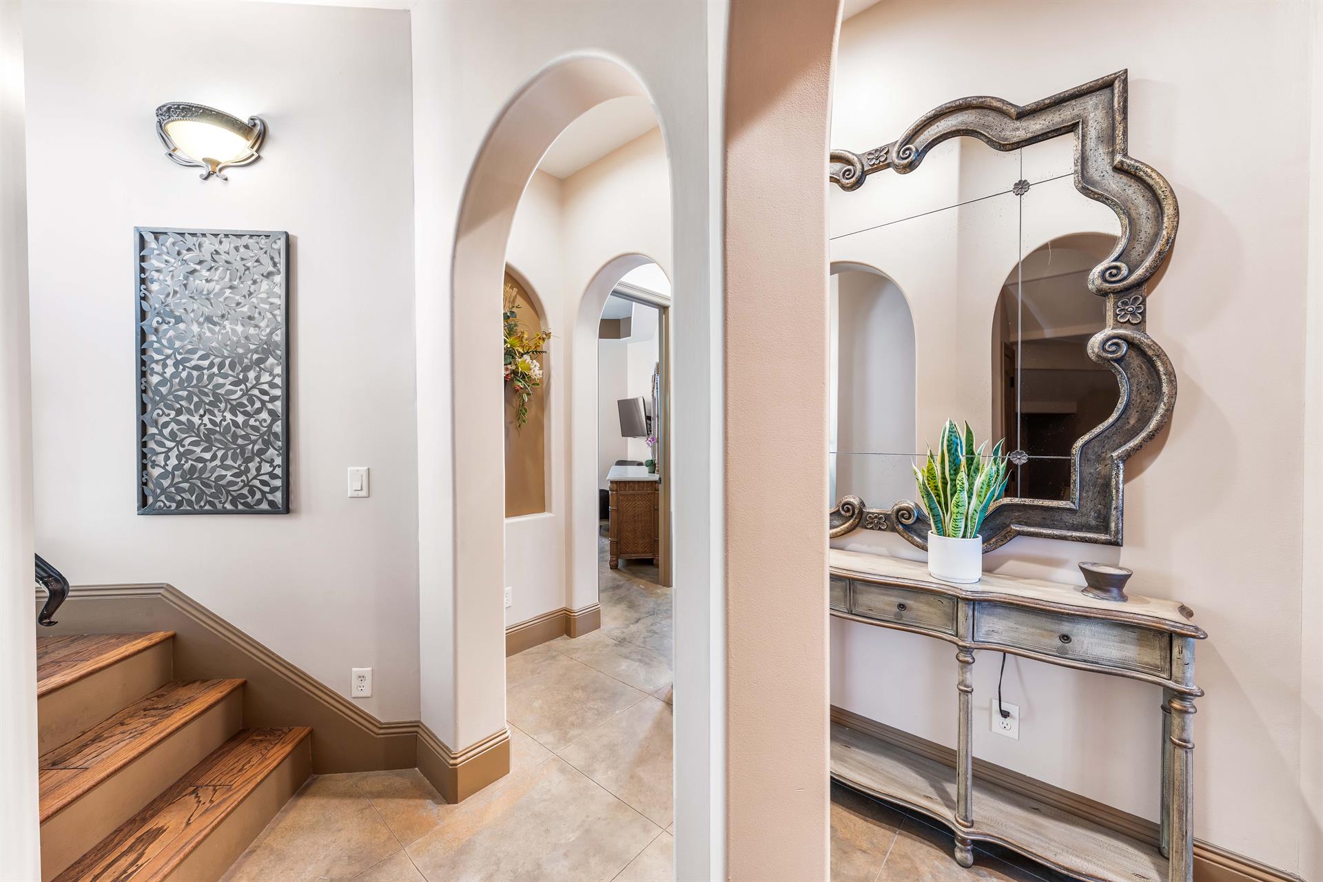 Elegance immediately greets you in the foyer with a unique curved staircase leading up to the 2nd floor.