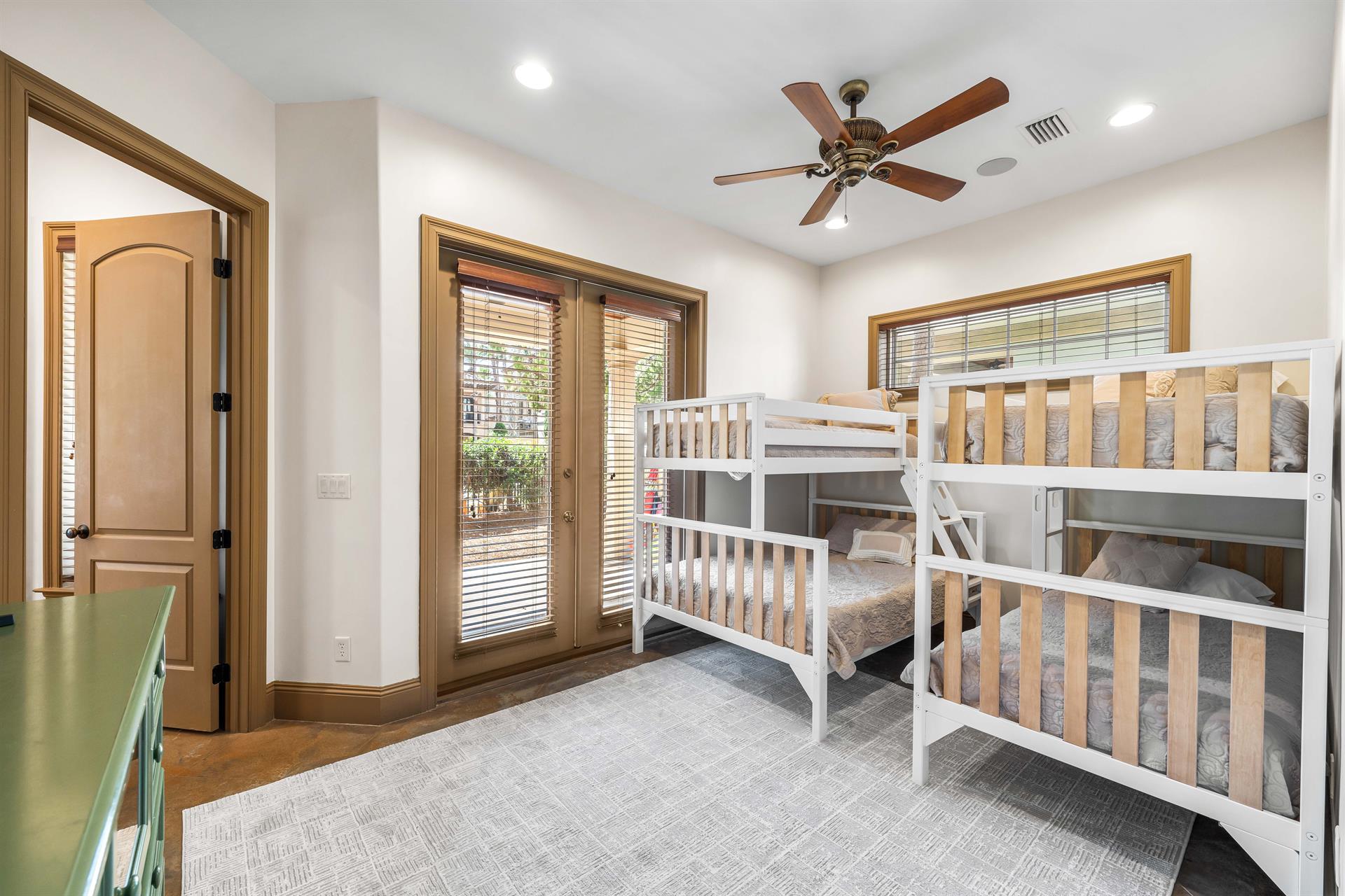 First floor bunk bedroom with a twin over twin and a twin over full beds.
