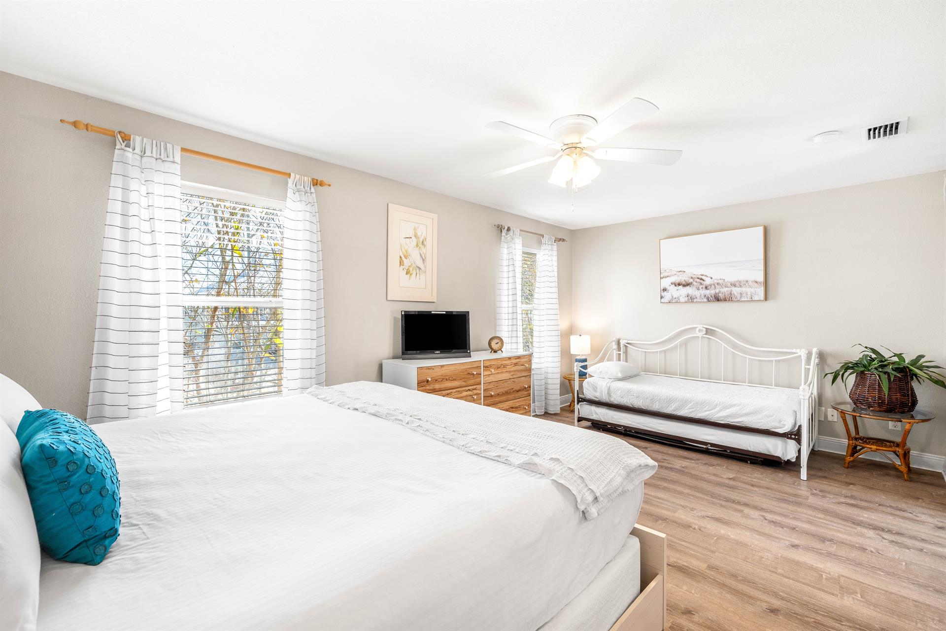 2nd floor guest king bedroom has a twin day bed with twin trundle, 26 Roku TV, and an ensuite bathroom.