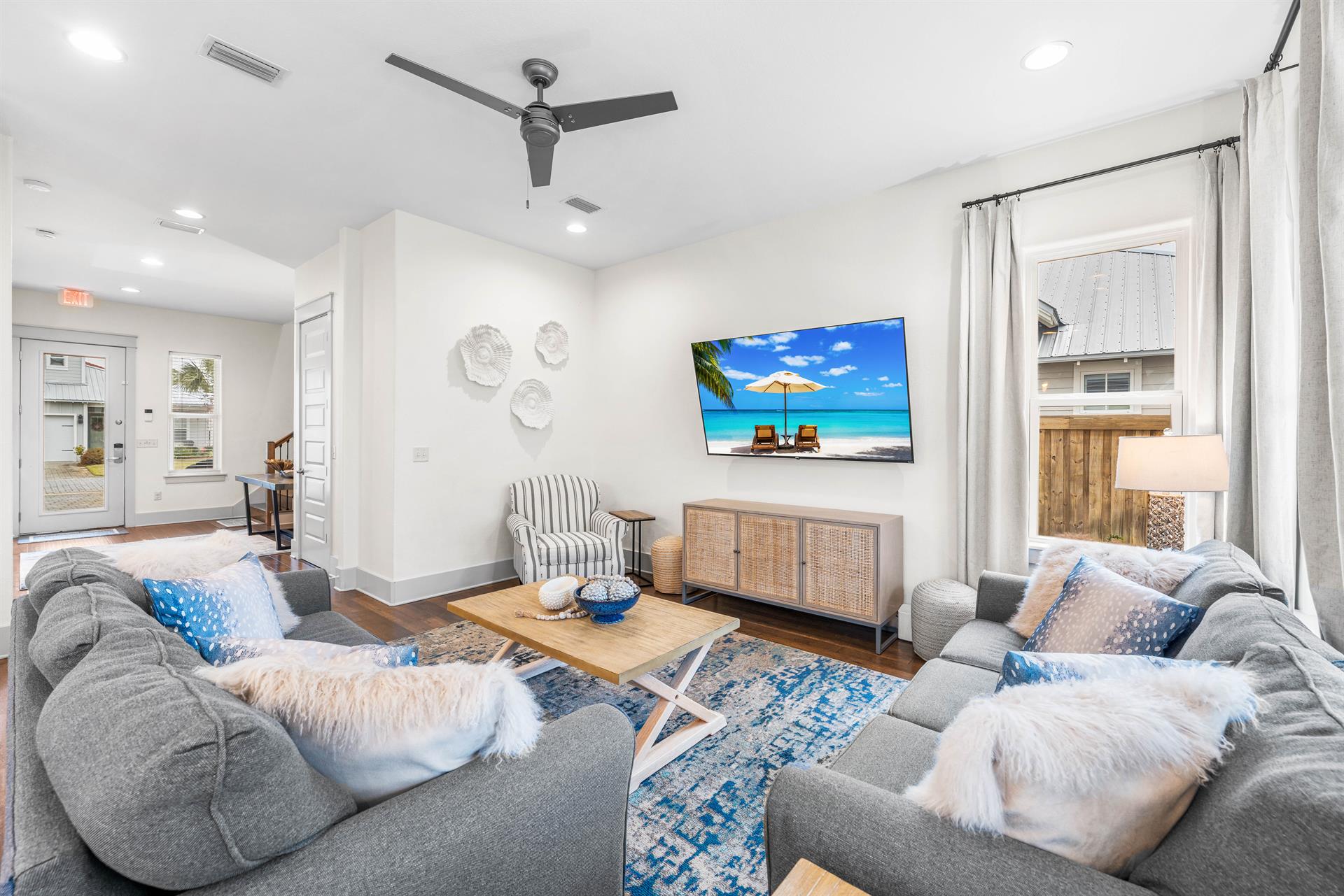 Gather together in the main living area with comfy sofas  75 smart tv with cable.