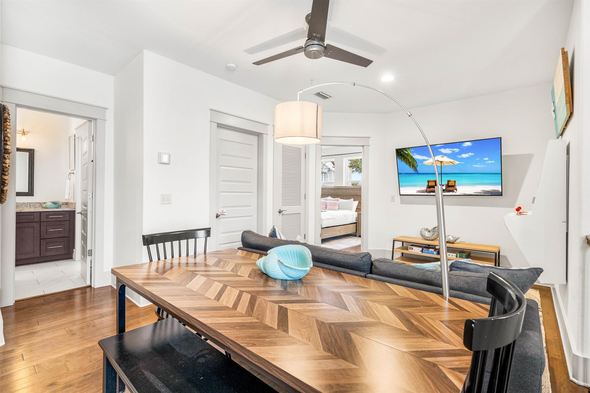 2nd floor bonus living area with kids in mind  Table for 6 perfect for games or puzzles.  Sofa  65 Smart TV with Cable Also  Polycade Arcade for the gamers