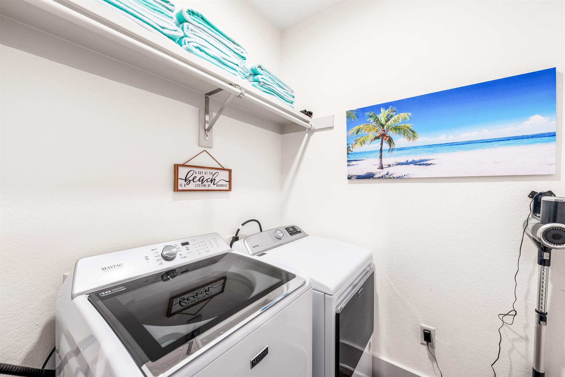 Convenience goals your own laundry space, full size washer  dryer, easy to use rechargeable vacuum and storage for the Frangista green  white beach towels