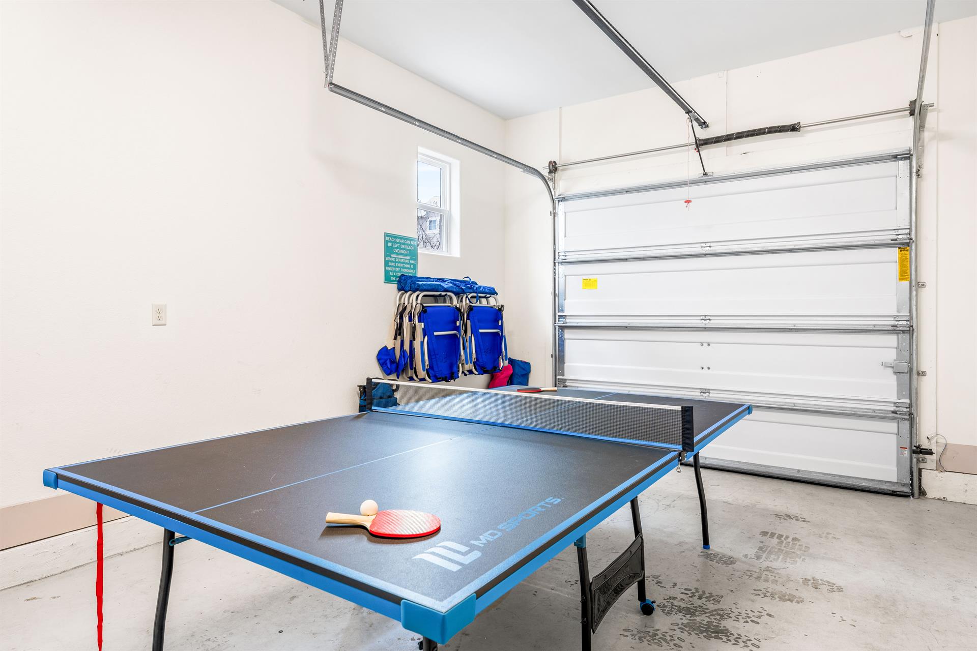 Anyone for Ping Pong or Bocce Ball   Sand toys for kids, lightweight beach chairs, cooler, beach wagon and cooler are stored here