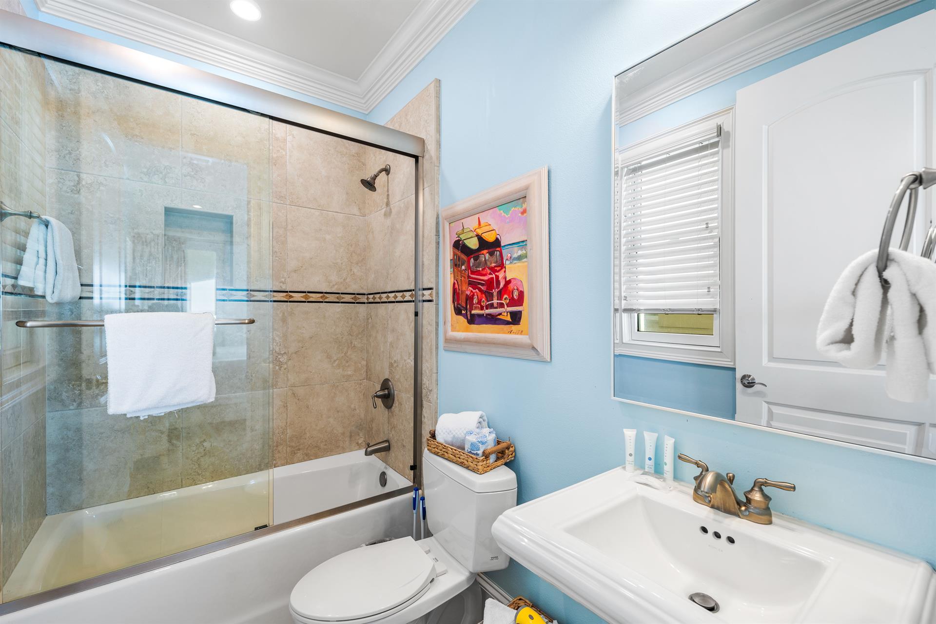 Ensuite Bathtub and Shower Combination with Pedestal Vanity for the first floor king bedroom.