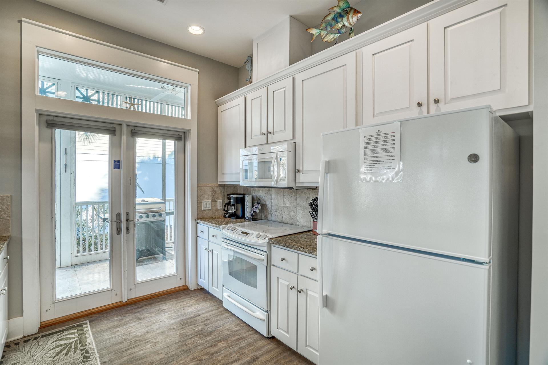 Galley style kitchen with plenty of storage space.