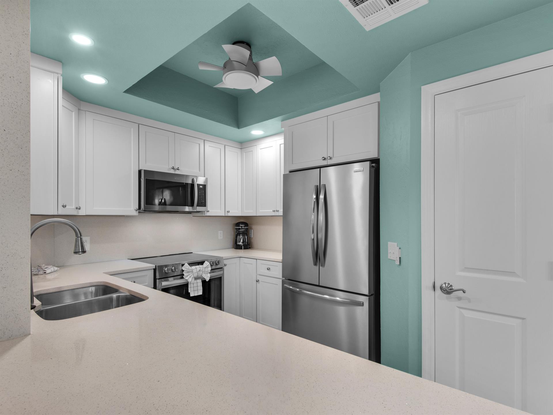 Fully Stocked Kitchen with Stainless Steel Appliances