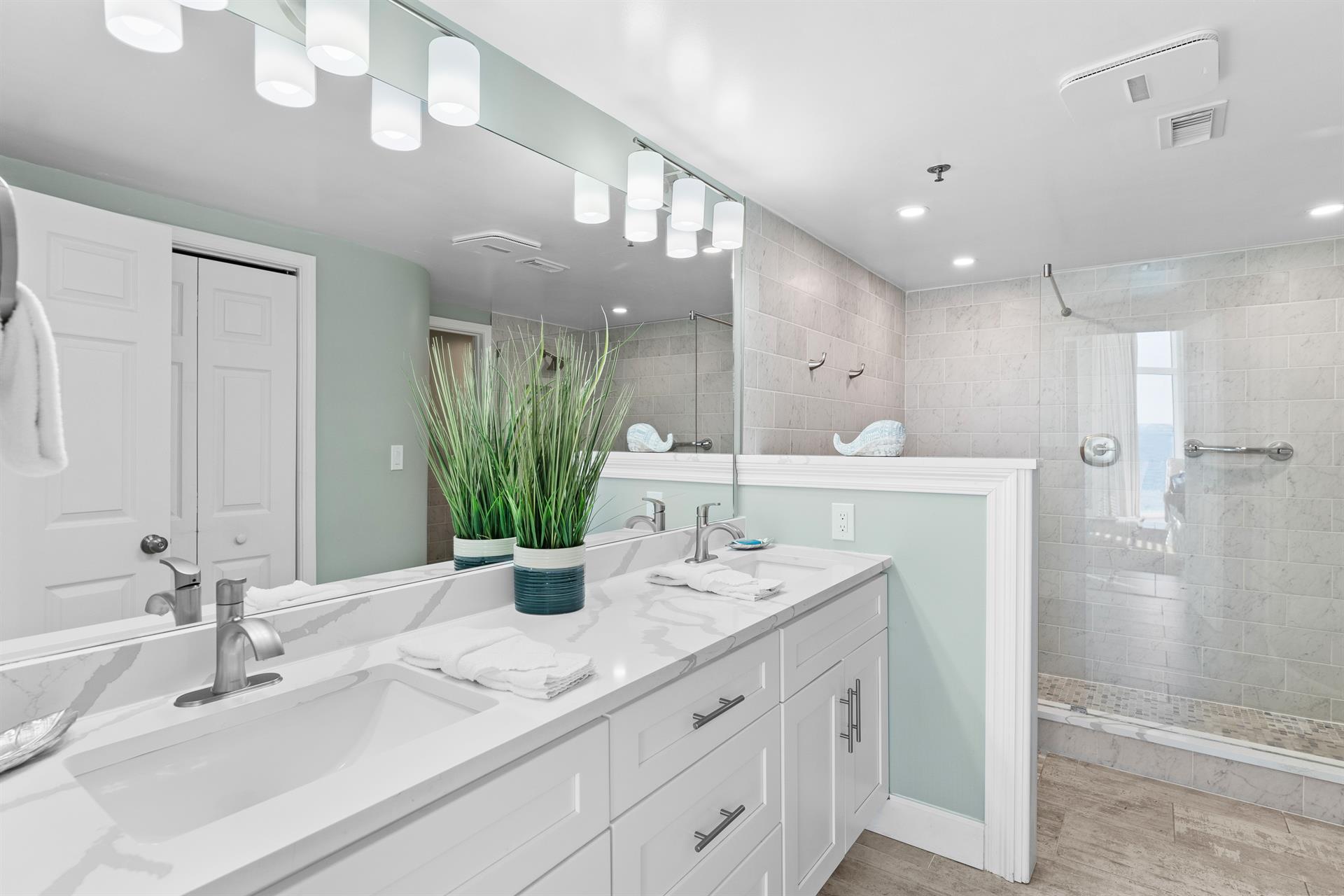 Primary Bathroom with Double Vanities and Walkin Shower