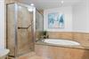 Primary bathroom with walk in shower and soaking tub