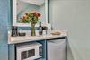 Kitchenette area with mini fridge, microwave and toaster