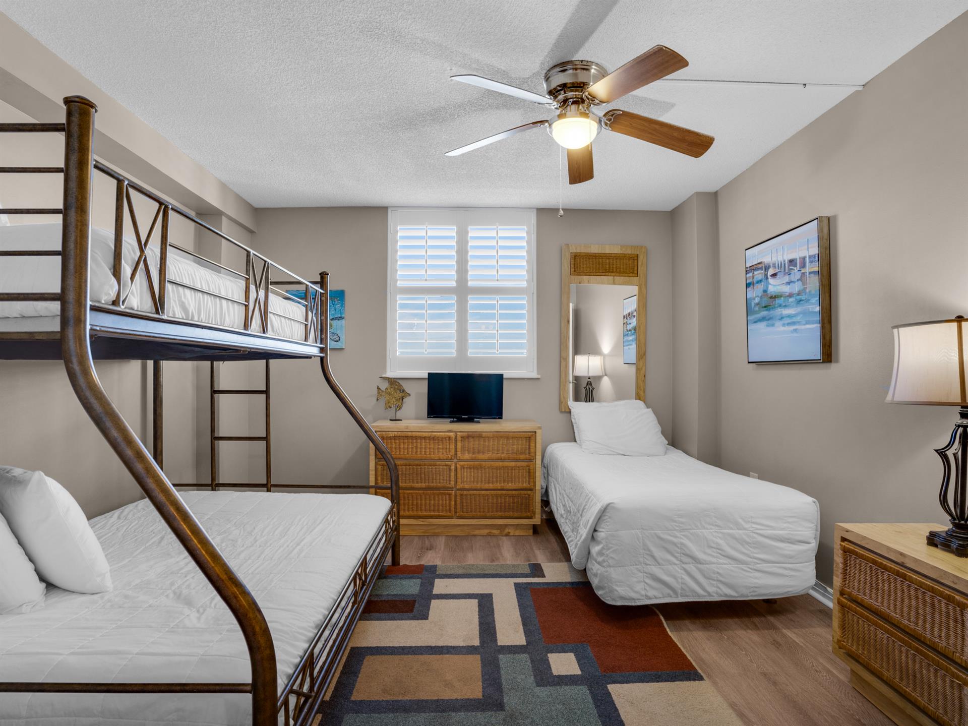 Guest Bedroom with twin over double bunk and additional twin bed