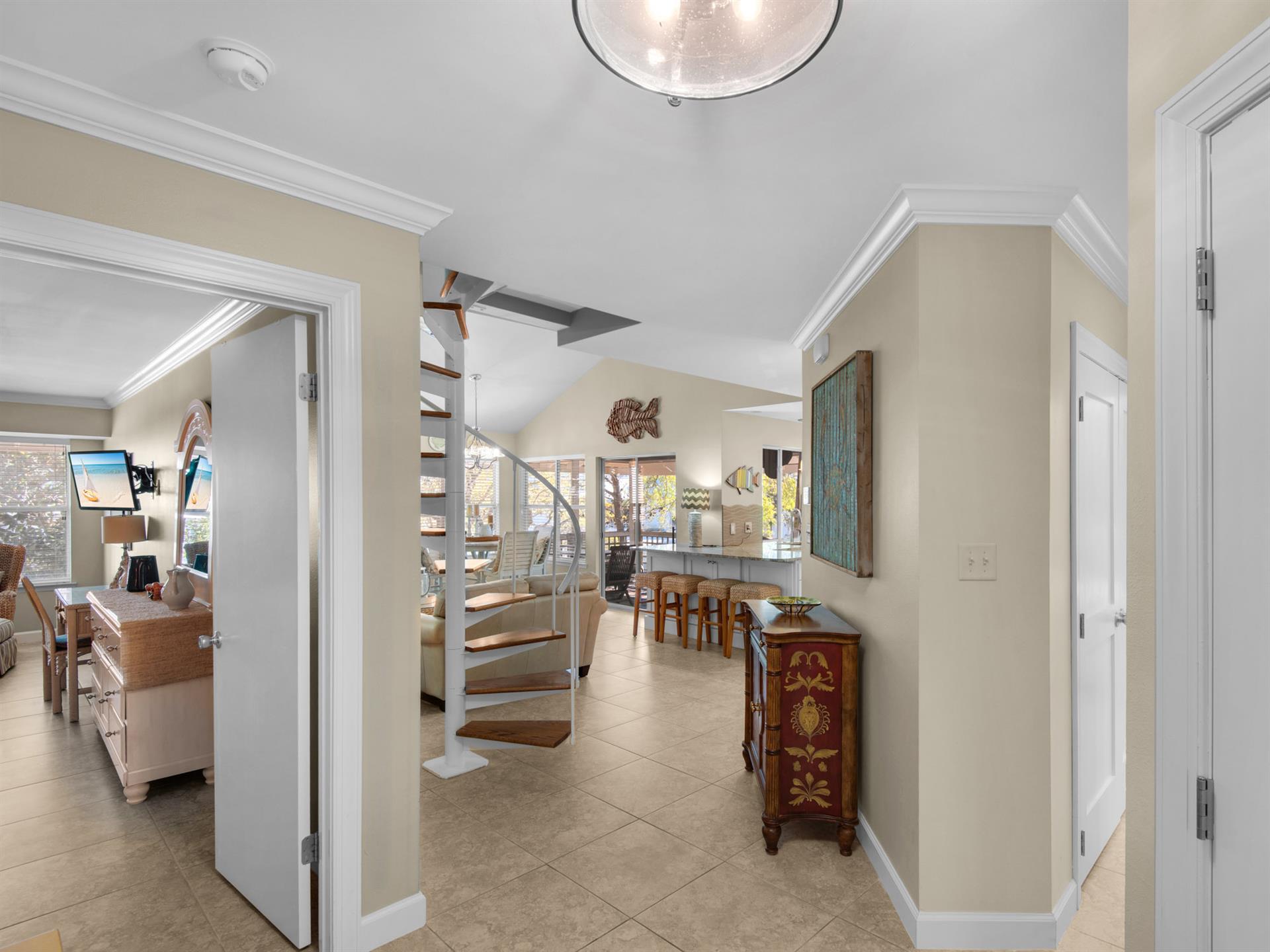 Cottage Entry with the Primary Bedroom to the left and Guest Bedroom to the Right