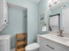 Half Bath off Primary Bedroom and Laundry Center