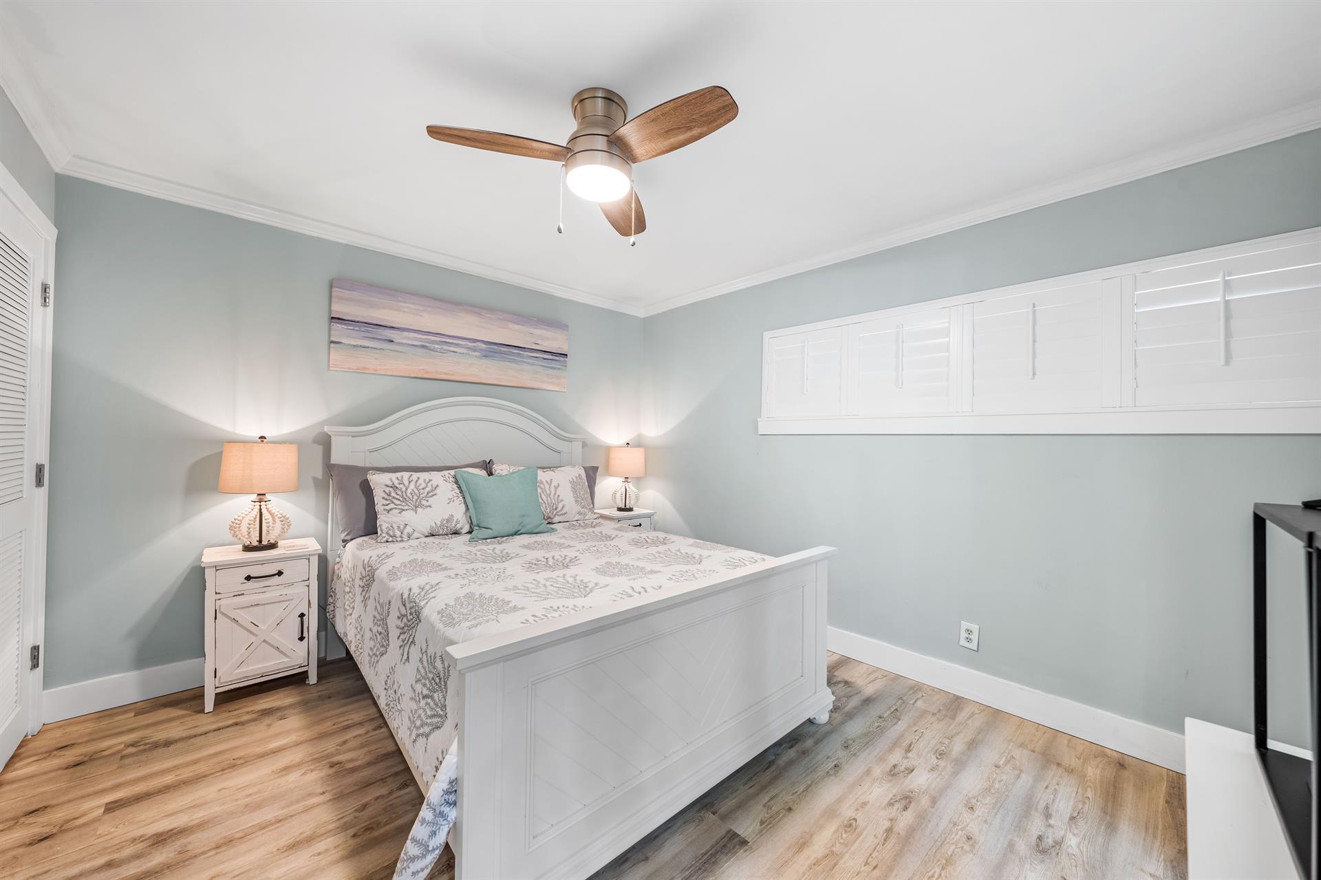 Second Bedroom With Queen Bed And Ceiling Fan