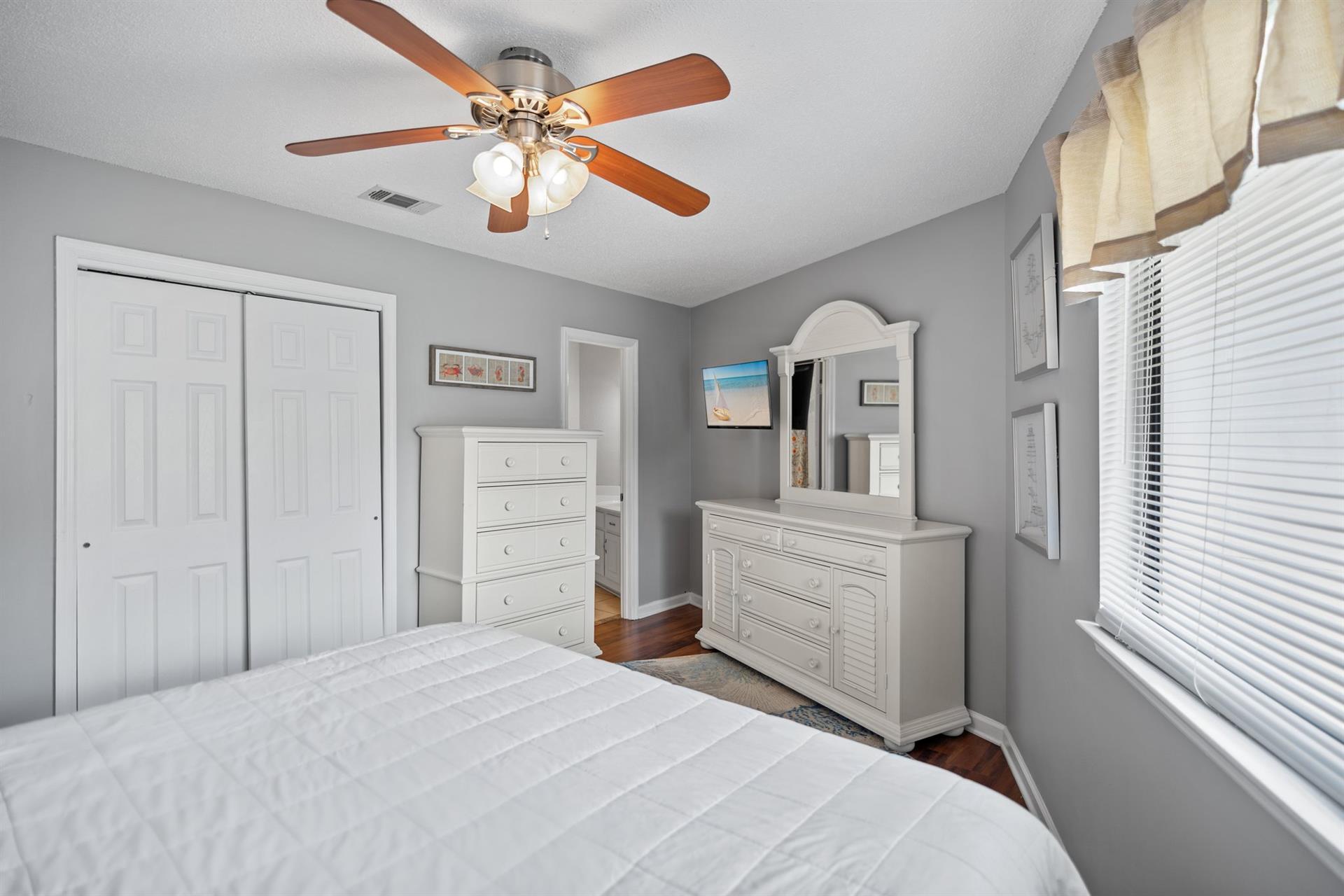 Primary Bedroom with King Bed and TV