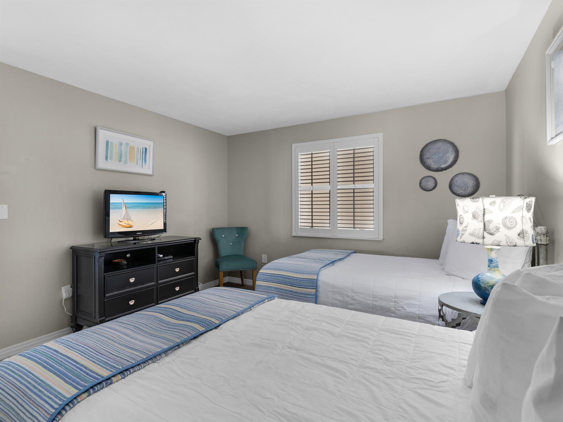 Guest Bedroom has Convenient Dresser for Additional Storage