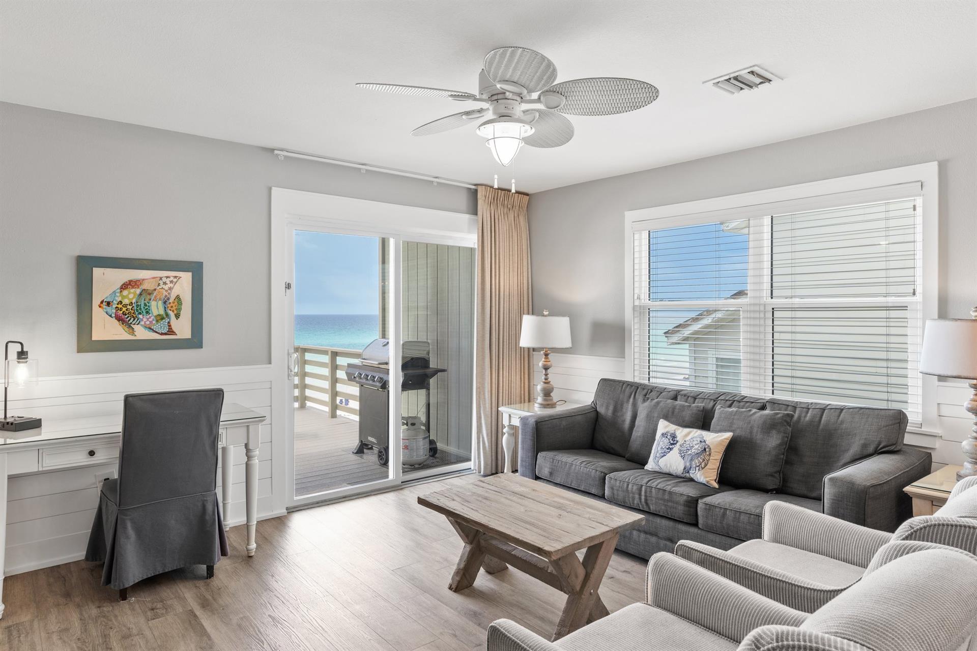 Desk and Living Area Opens to a Private Deck