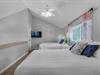 Two Double Beds and Flat Screen Television in Upstairs Bedroom 3
