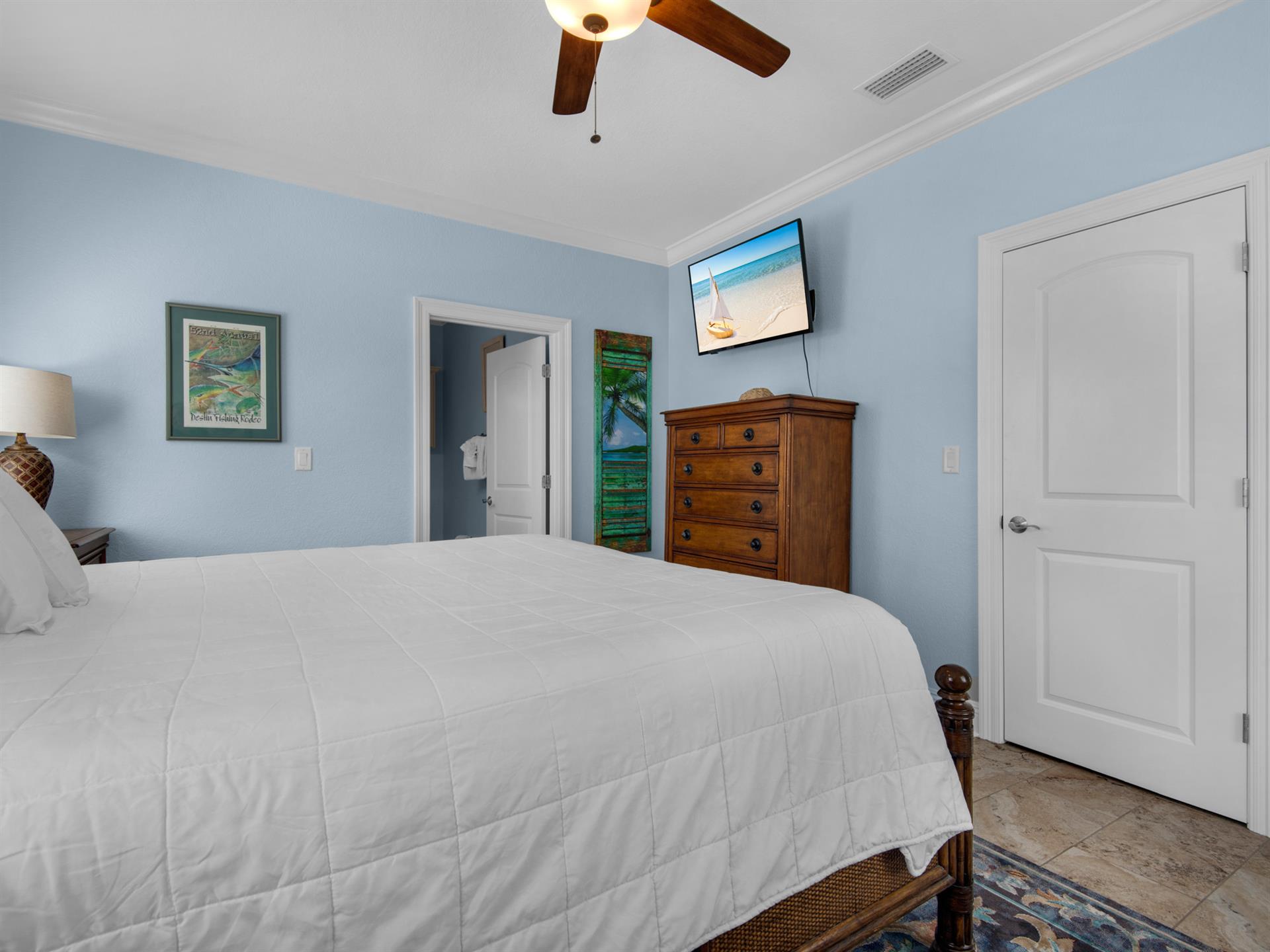 Primary Bedroom on Main Floor with King Bed and TV