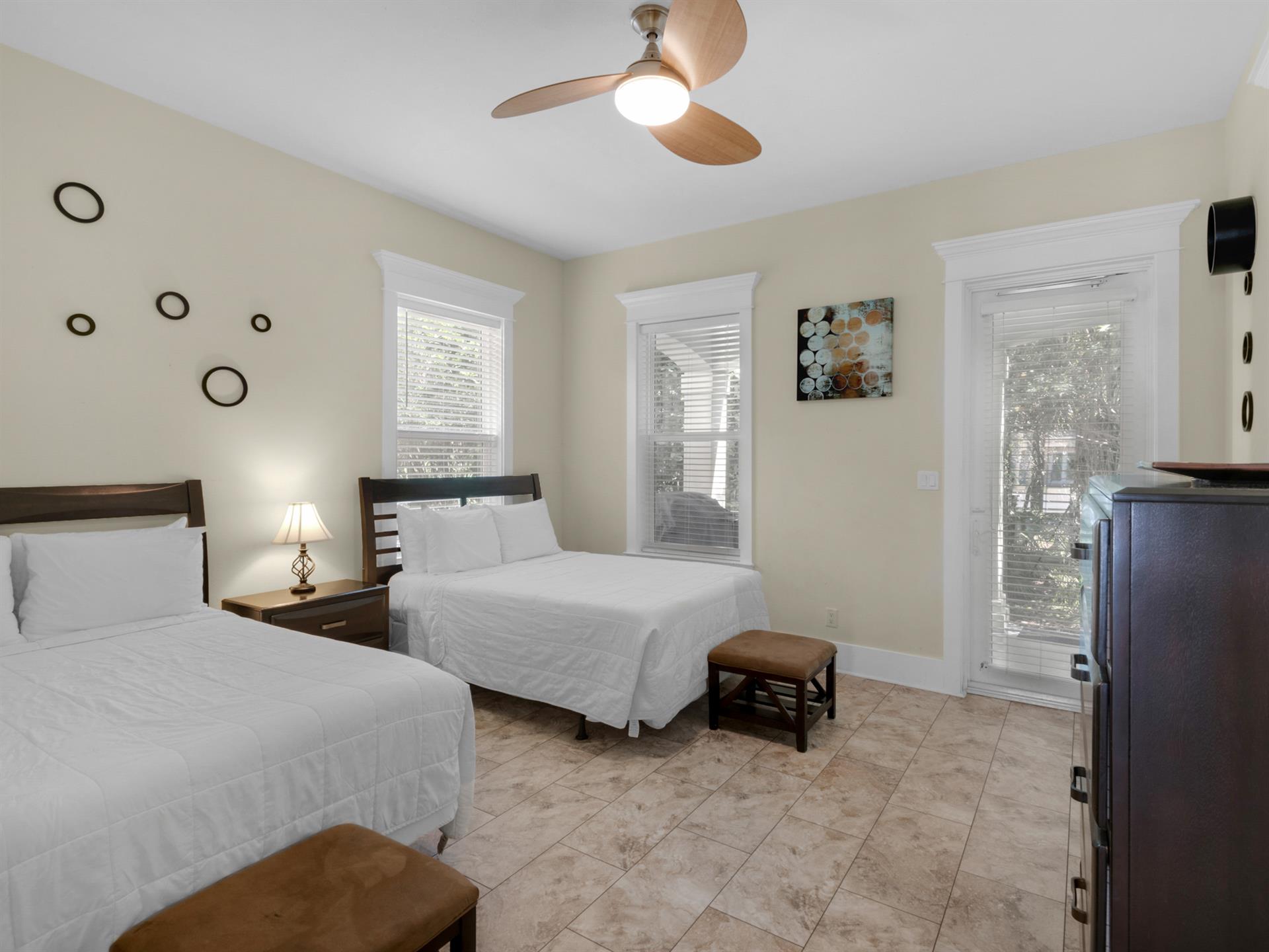 1st floor bedroom 1 with back door access to porch and grilling area