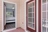 Primary Bedroom with King Bed leading to Front Porch