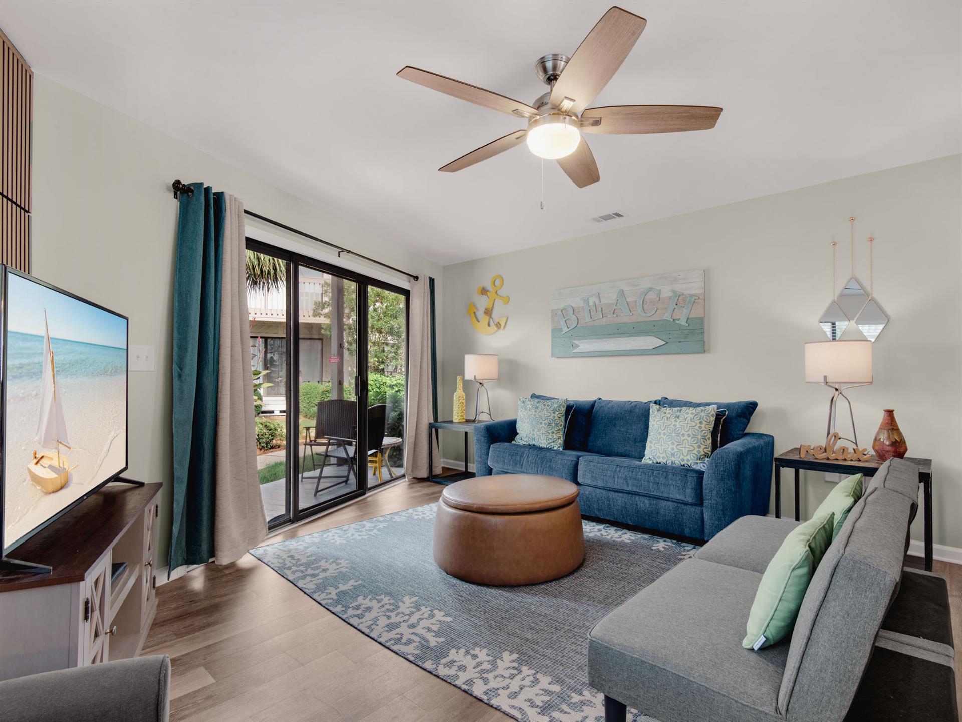 Living Area with Large TV and Patio Access