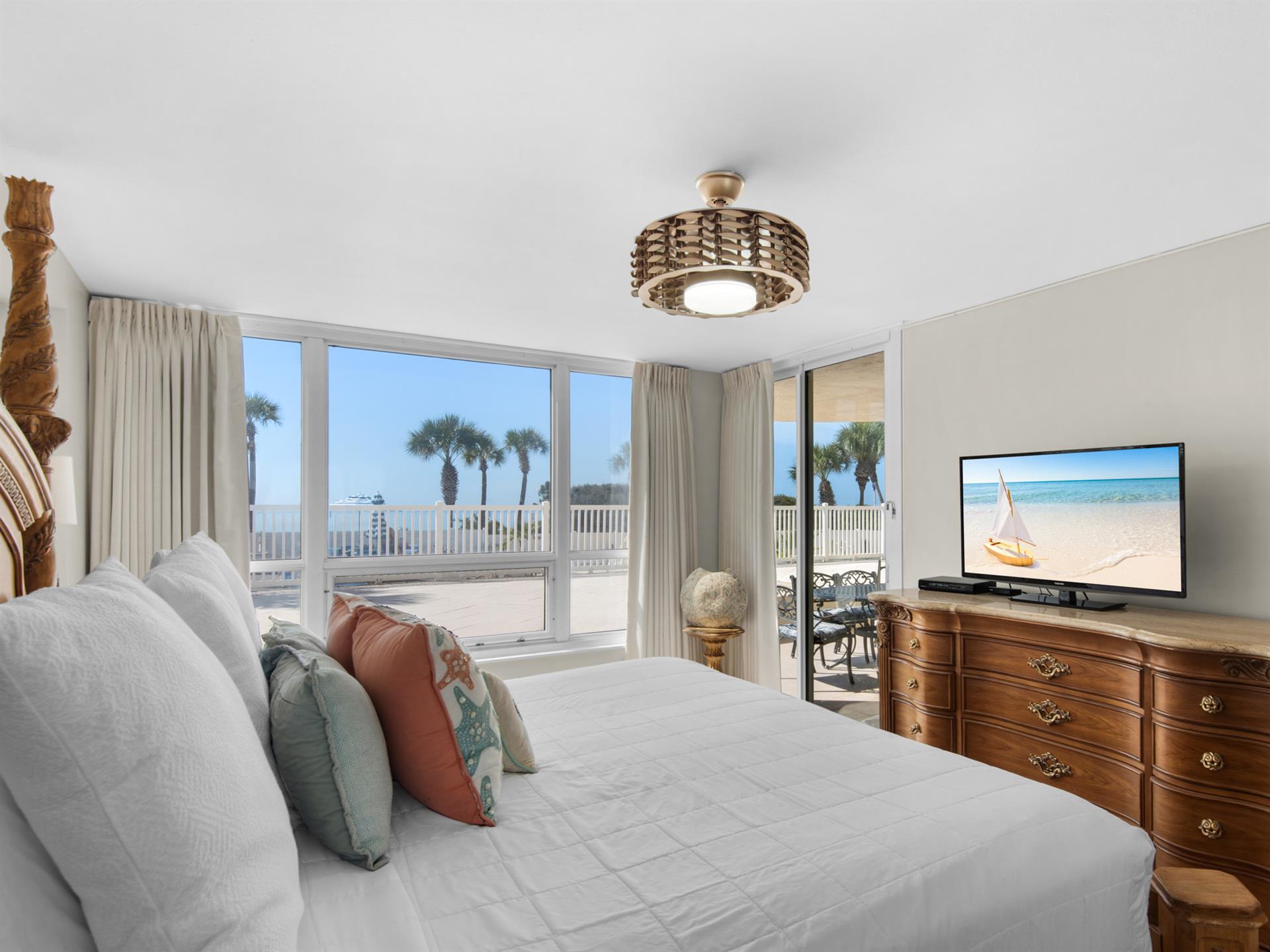 Primary Bedroom with Private Entrance to Patio and Flat Screen TV