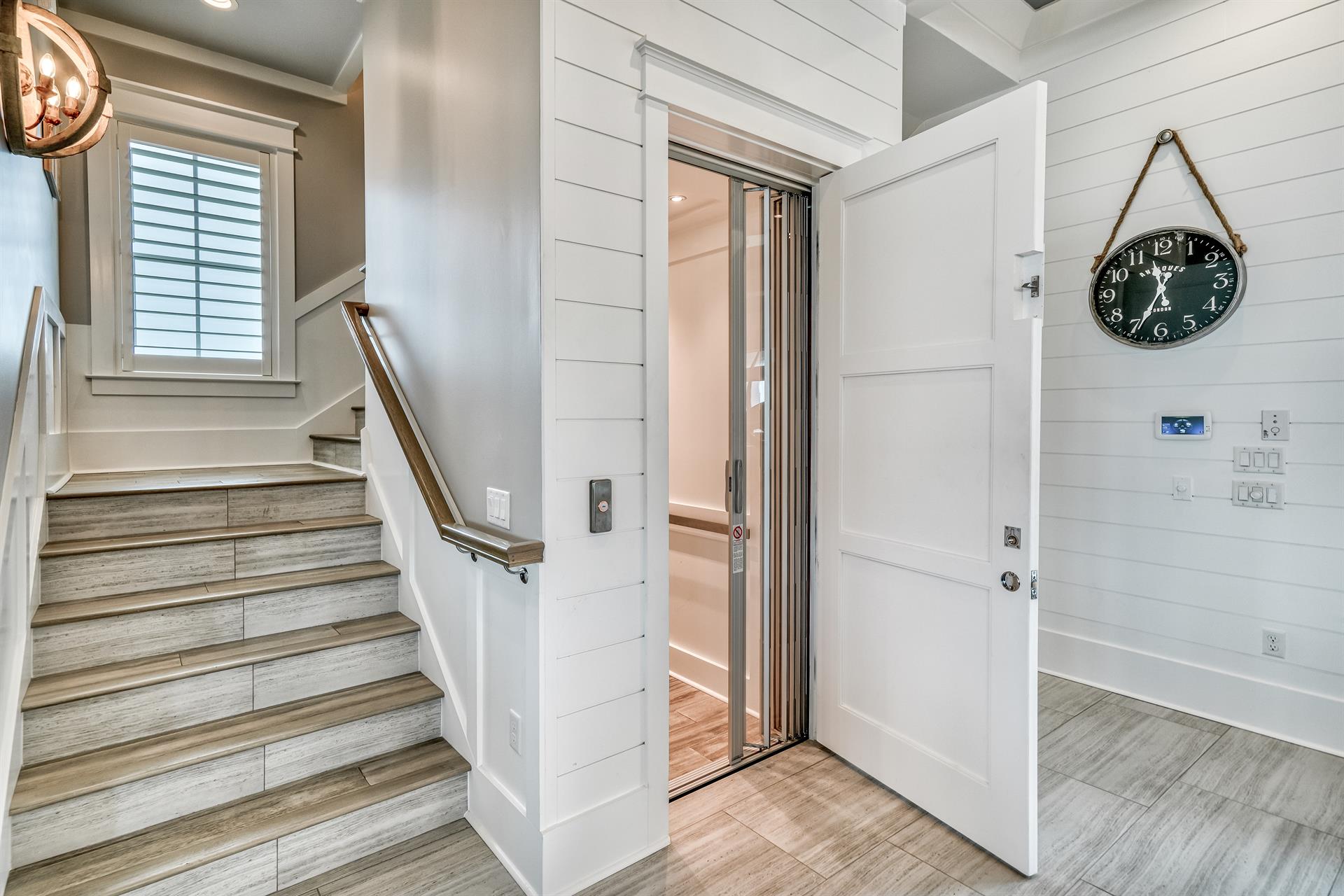 First floor stairs and elevator servicing all three floors.