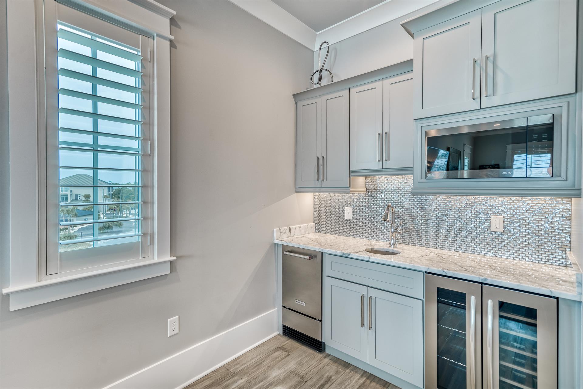 Third floor media room kitchenette.