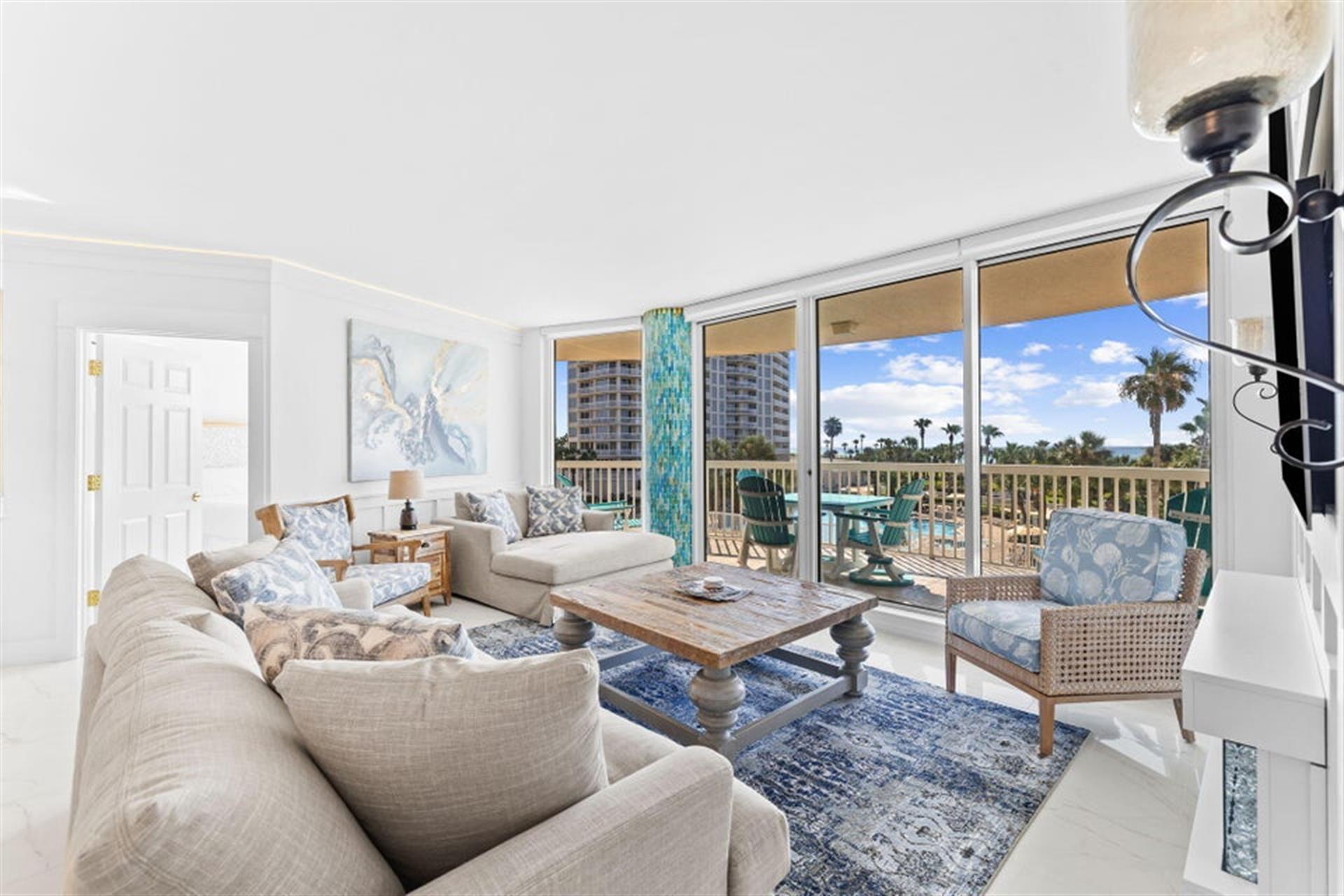 Living Room with a Beach and Pool View