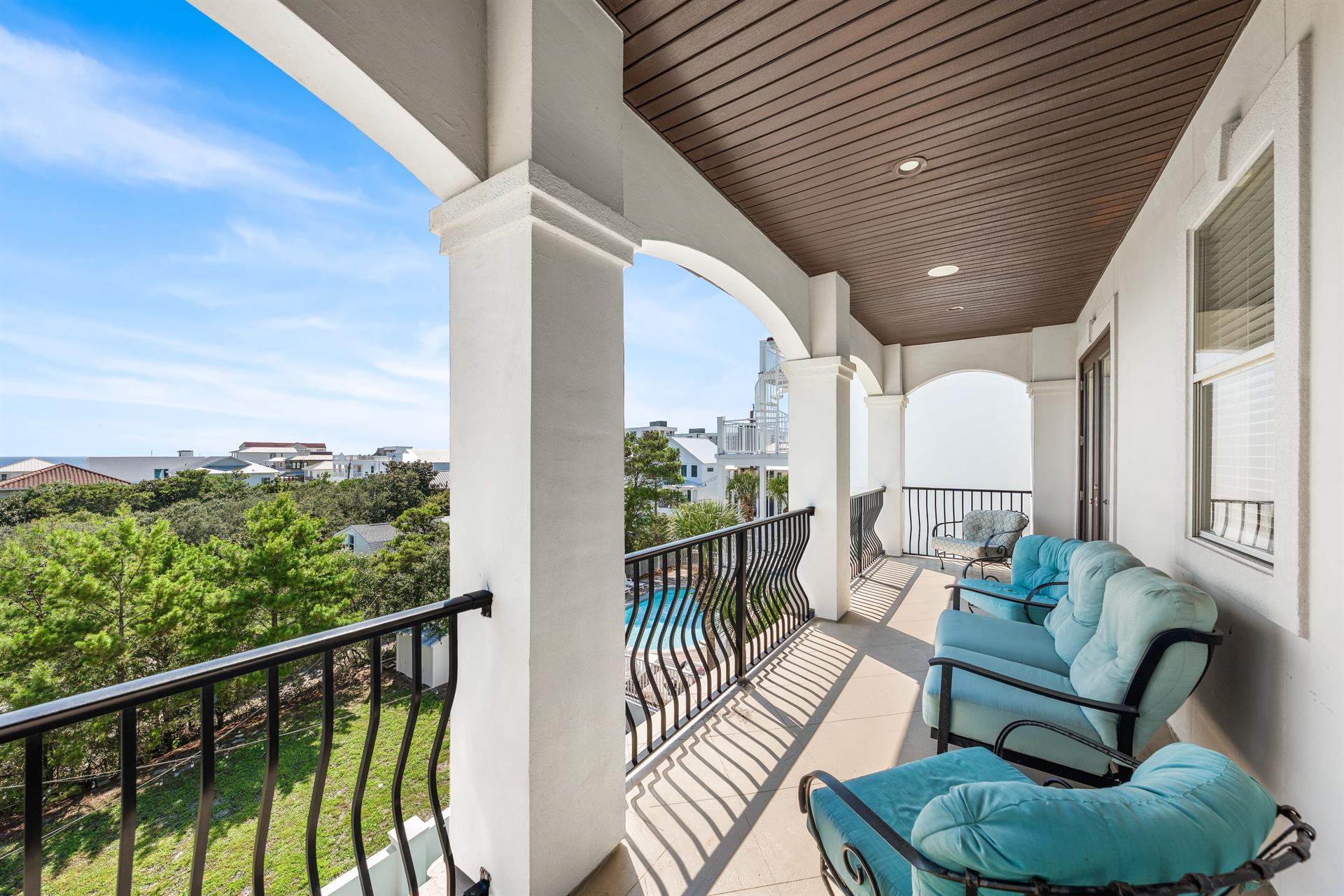 3rd Floor Balcony Overlooking Pool and Neighborhood