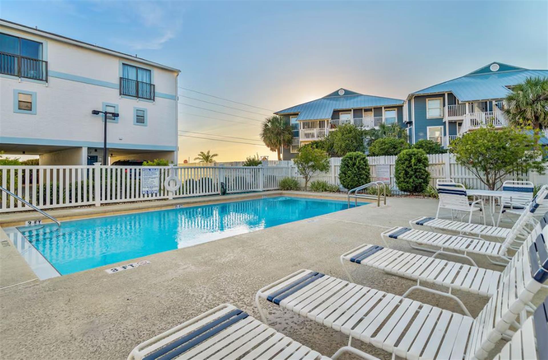 Community Pool with Lounge Chairs
