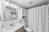Full showertub and updated vanity make this bathroom vacationr